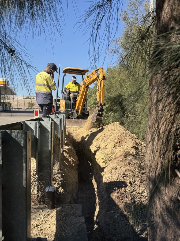 Excavator with operator preparing construction site in Australia for residential earthmoving project